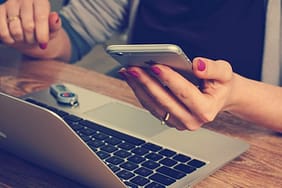 using phone and laptop